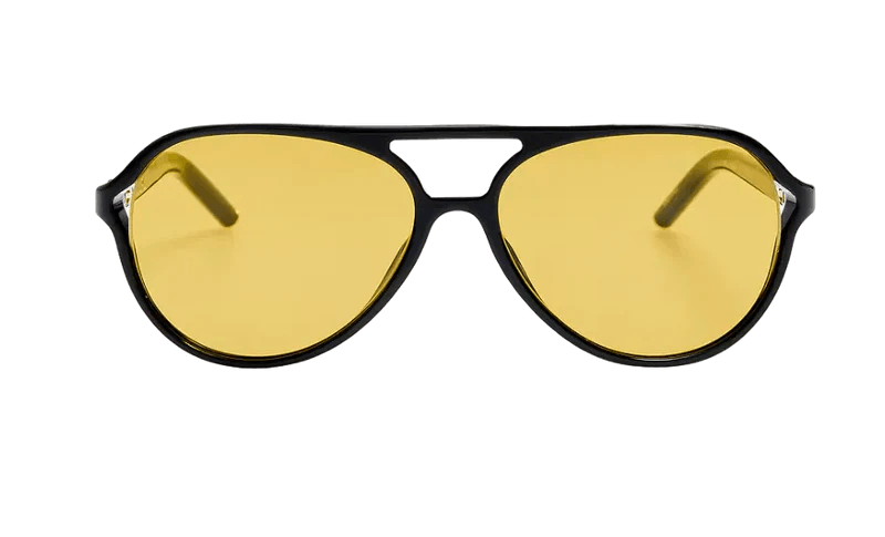 Black aviator-style eyeglass frames with yellow-tinted lenses, featured in our Nashville Finds for May, displayed on a plain white background.