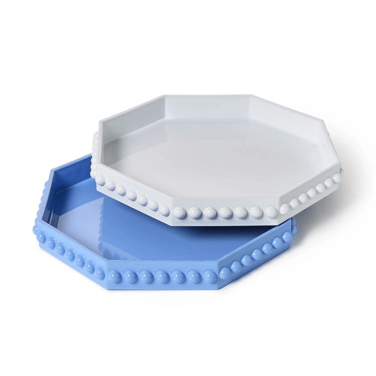 Two hexagonal trays, one light blue and one white, each with a raised border decorated with round beads, stacked slightly askew—a perfect addition to your stylish finds from Southern FINDS.