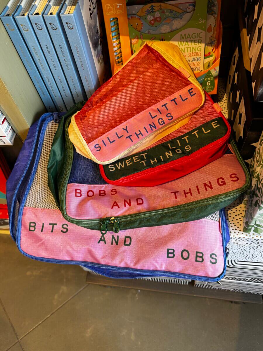 15 Louisville FINDS for May: Spring Fashion, Entertaining Essentials & More - 16 Four colorful mesh bags with text labelsββSILLY LITTLE THINGS,β βSWEET LITTLE THINGS,β βBOBS AND THINGS,β and βBITS AND BOBSββspotted among charming Louisville finds this May, displayed neatly on a store shelf.