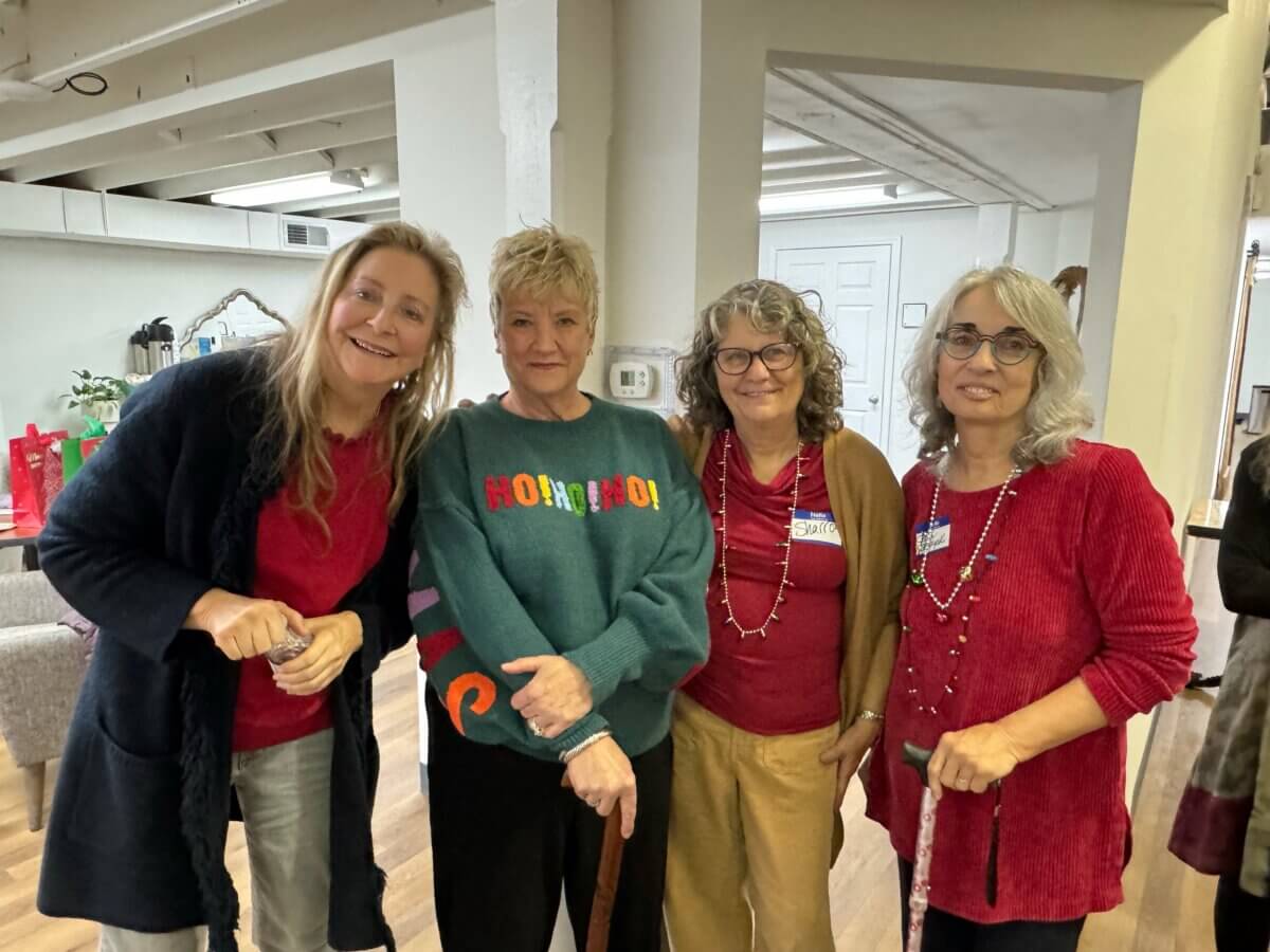 Meet the Memphis Gardener Who Sparked a Citywide Movement - 6 Four women, including Kim Halyak, stand together indoors, smiling at the camera. Two hold canes. Holiday decorations are visible in the background.