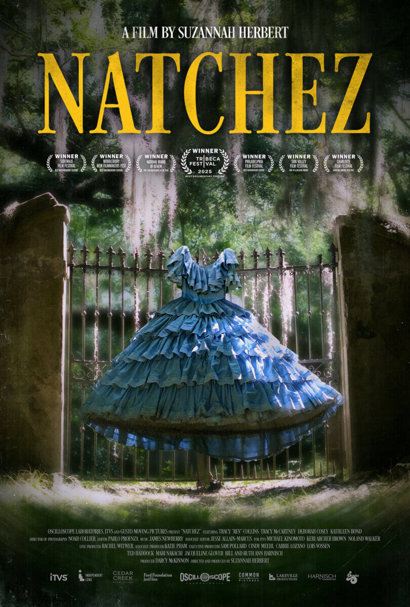 This Memphis Filmmaker is Reframing the Southern Story - 4 A blue ruffled dress hangs on an ornate iron gate in a shaded, overgrown outdoor setting. The film title "NATCHEZ" is displayed above in large yellow text.