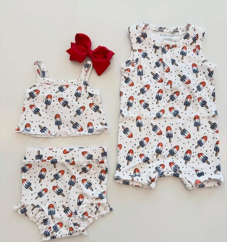 Your Guide to Nashville's Coolest Children's Stores - 7 This playful set, featuring three baby clothing items with a red, white, and blue popsicle print and a red bow headband.