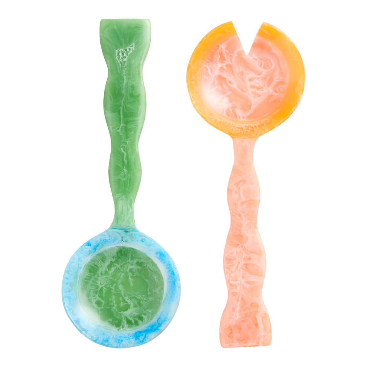A pair of marbled salad servers—one green and blue spoon, one orange and pink fork, both with wavy handles—make an outdoor entertaining must-have for colorful al fresco dining.