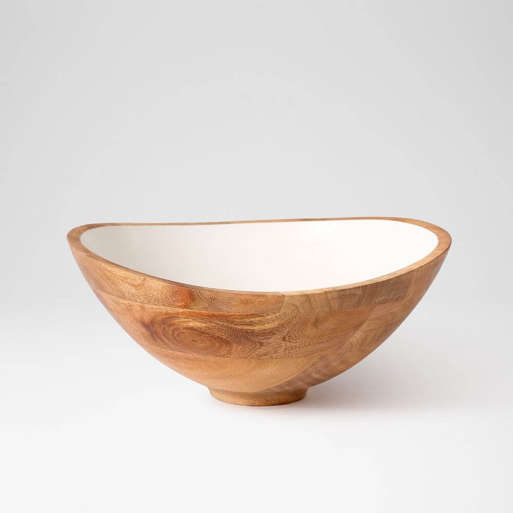 A must-have for outdoor entertaining, this wooden bowl features a white interior and an irregular, slightly asymmetrical shape, placed against a plain white background.