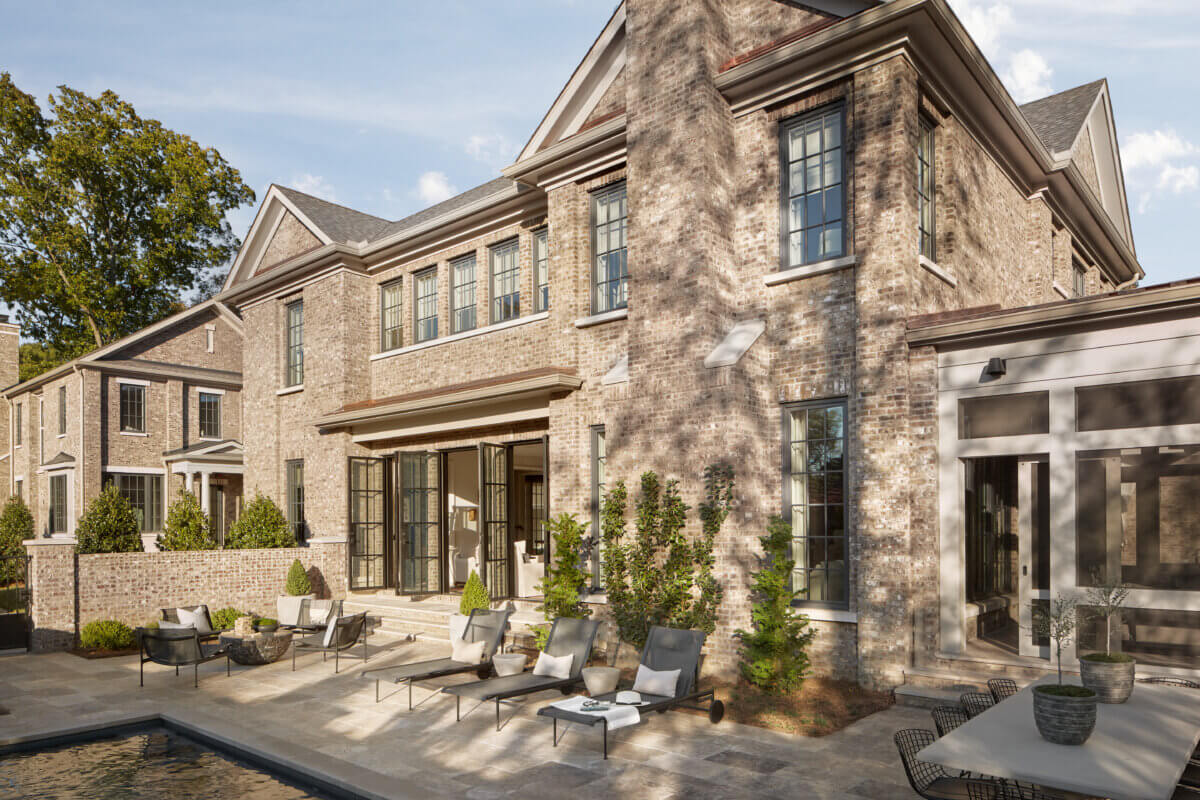 10 Designer Tips for Upgrading Your Outdoor Spaces - 3 The exterior of a large estate home in Nashville, showing the patio surrounding an in-ground pool.