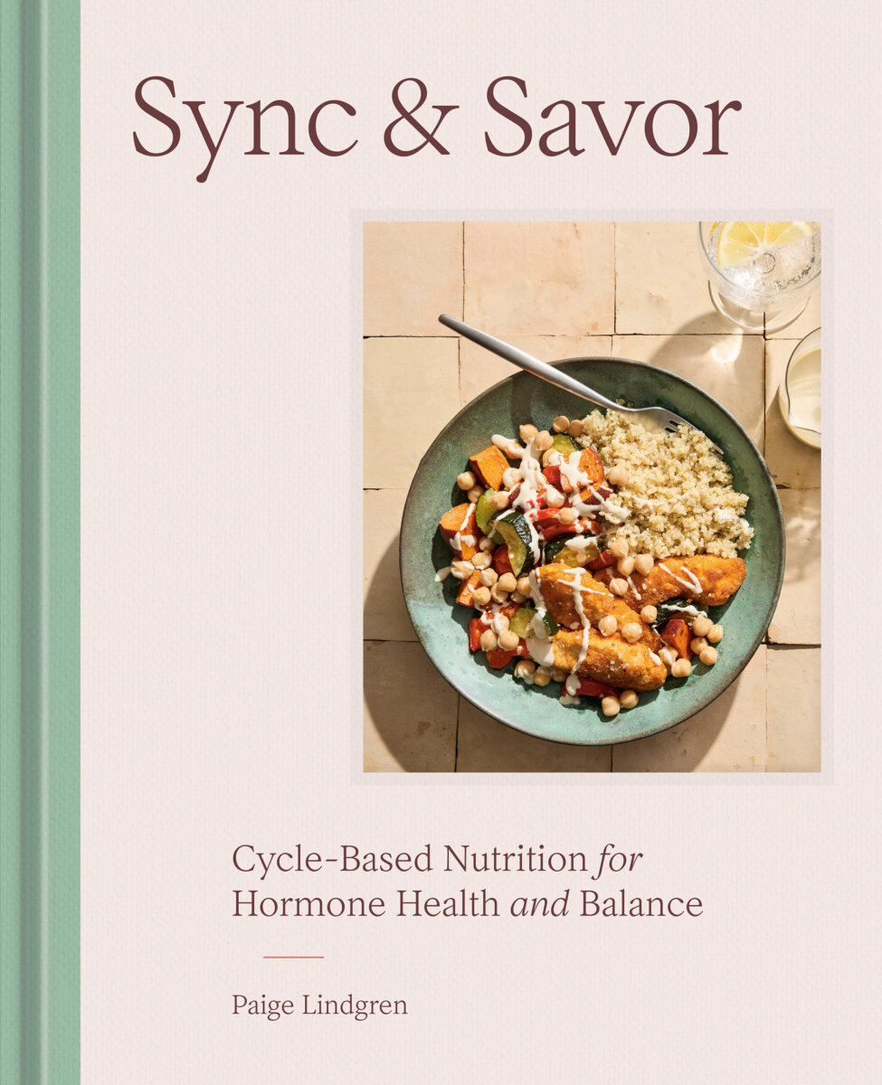 Book cover titled "Sync & Savor" by Paige Lindgren, featuring a plate of plant-based, hormone balancing foods and the subtitle "Cycle-Based Nutrition for Hormone Health and Balance." Perfect for those interested in cycle syncing.