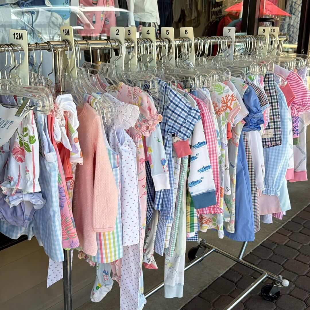 8 Birmingham Children's Boutiques for Every Age - 9 A clothing rack outside Little Lavendar features colorful baby and toddler outfits, sorted by size from 12 months to 5 years.