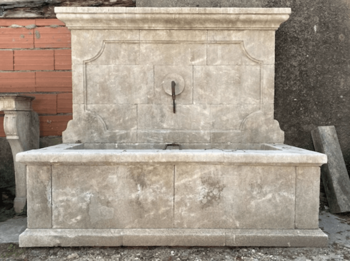 17 Luxurious Birmingham FINDS: Polished Summer Style, Artful Decor & Everyday Luxuries - 15 Luxurious stone outdoor wall fountain with a rectangular basin and central spout, set against a brick and concrete wall—perfect for enjoying a relaxing Birmingham summer.