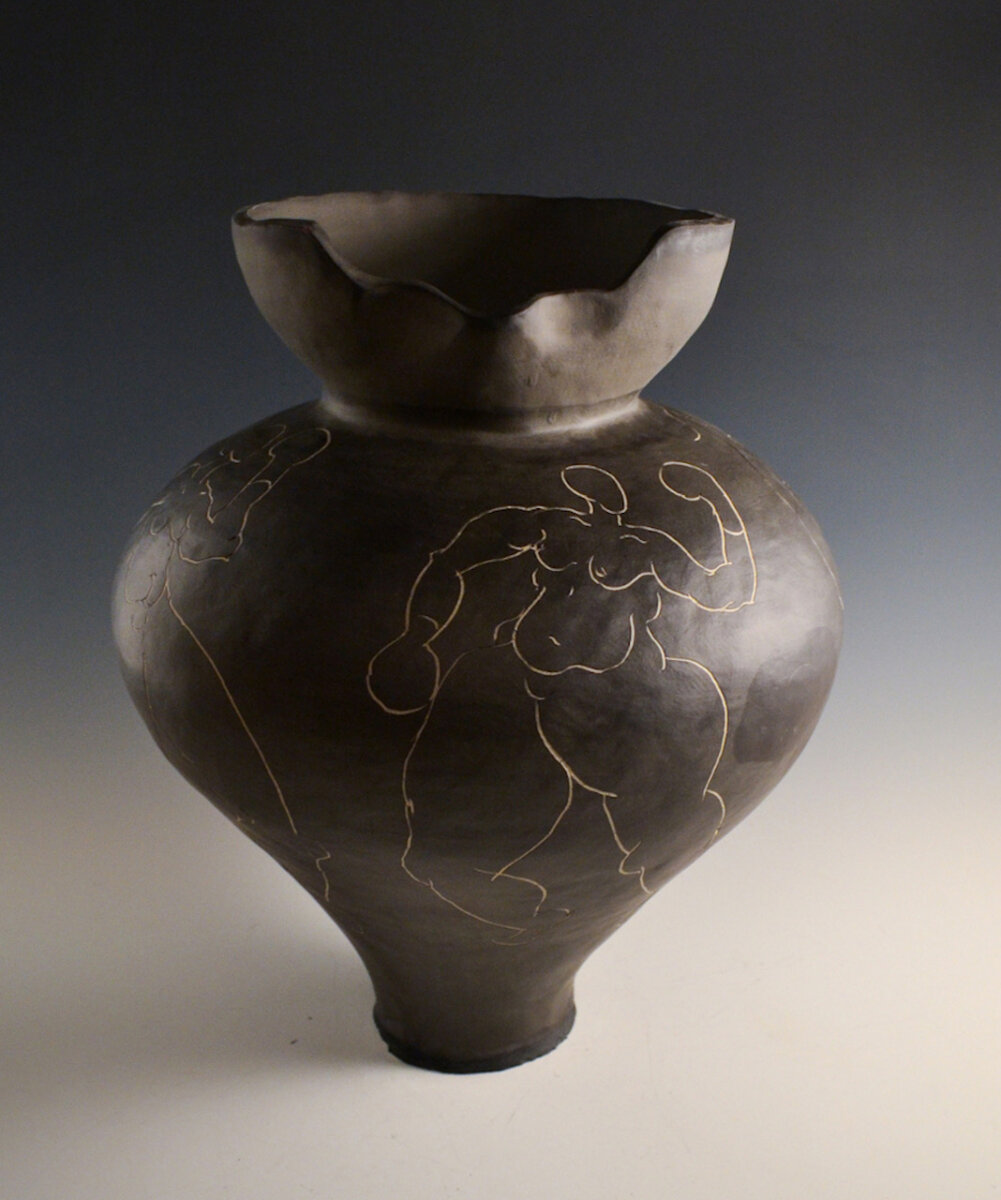 How Louisville Artist Robyn Gibson Turns Boxing Into Art - 3 A dark, bulbous ceramic vase by Robyn Gibson with a wavy, uneven rim and etched outlines of abstract human figures.