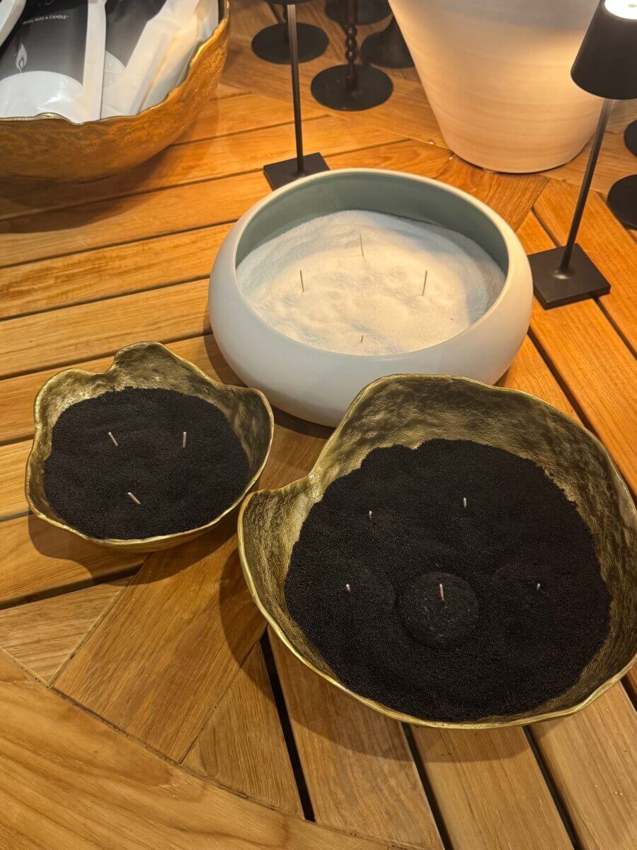 16 Louisville FINDS for June: Summer Style, Tabletop Charm & Little Luxuries - 9 Three decorative bowls filled with sand—two with black sand and one with white—each holding vertical incense sticks, arranged on a wooden table, making these tranquil accents perfect for your summer picks of everyday luxuries.