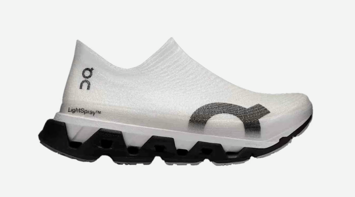 16 Luxe Louisville FINDS for July: Fine Art, Rare Bourbon & Resort-Ready Style - 15 A white, slip-on athletic shoe with a black geometric sole and minimalist branding, featured as one of July's Luxe Louisville finds, displayed on a plain background.
