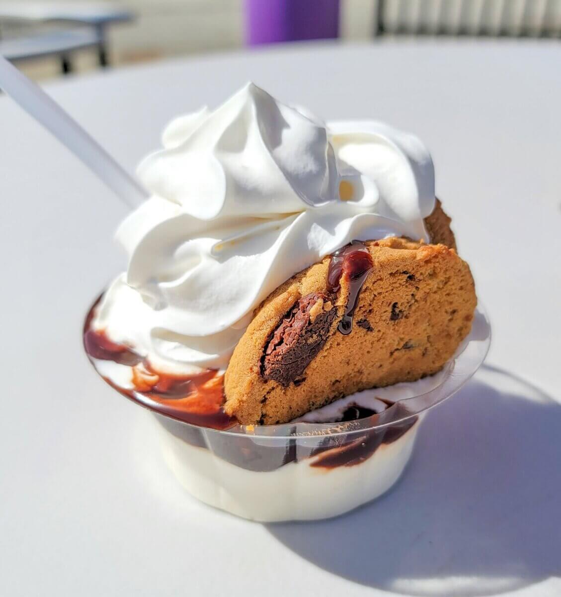 10 Louisville Ice Cream Spots to Beat the Heat - 3 A plastic cup filled with vanilla soft serve ice cream, chocolate syrup, whipped cream, and a chocolate chip cookie—with a spoon inserted—makes this one of the must-try Louisville ice cream treats for summer.