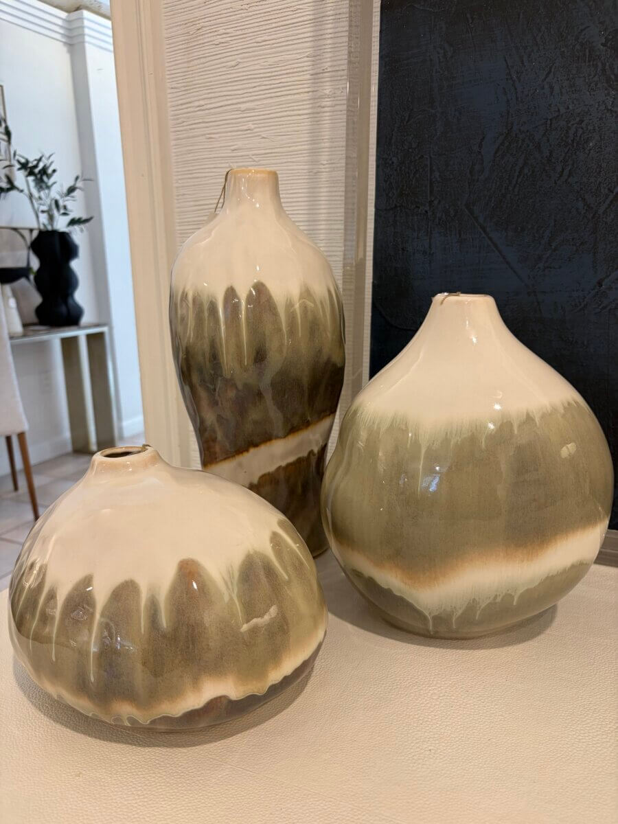 15 Birmingham FINDS for August: Breezy Fashion, Entertaining & More - 10 Three ceramic vases with rounded shapes and a two-tone glaze of cream and earthy green are displayed on a light-colored surface indoors, evoking the natural charm of Birmingham Finds this August.