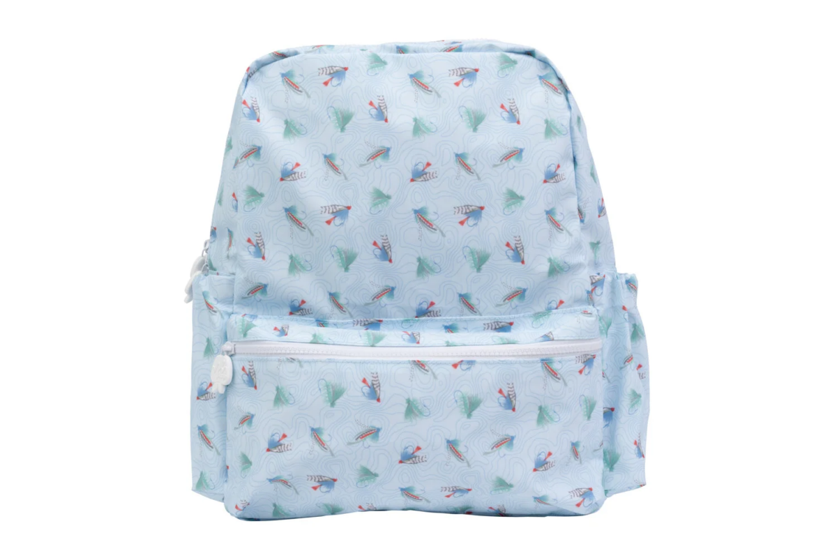 Light blue backpack with a fish and leaf pattern, featuring two zippered front pockets and side pockets, photographed on a white background—an August FINDS favorite in Nashville.