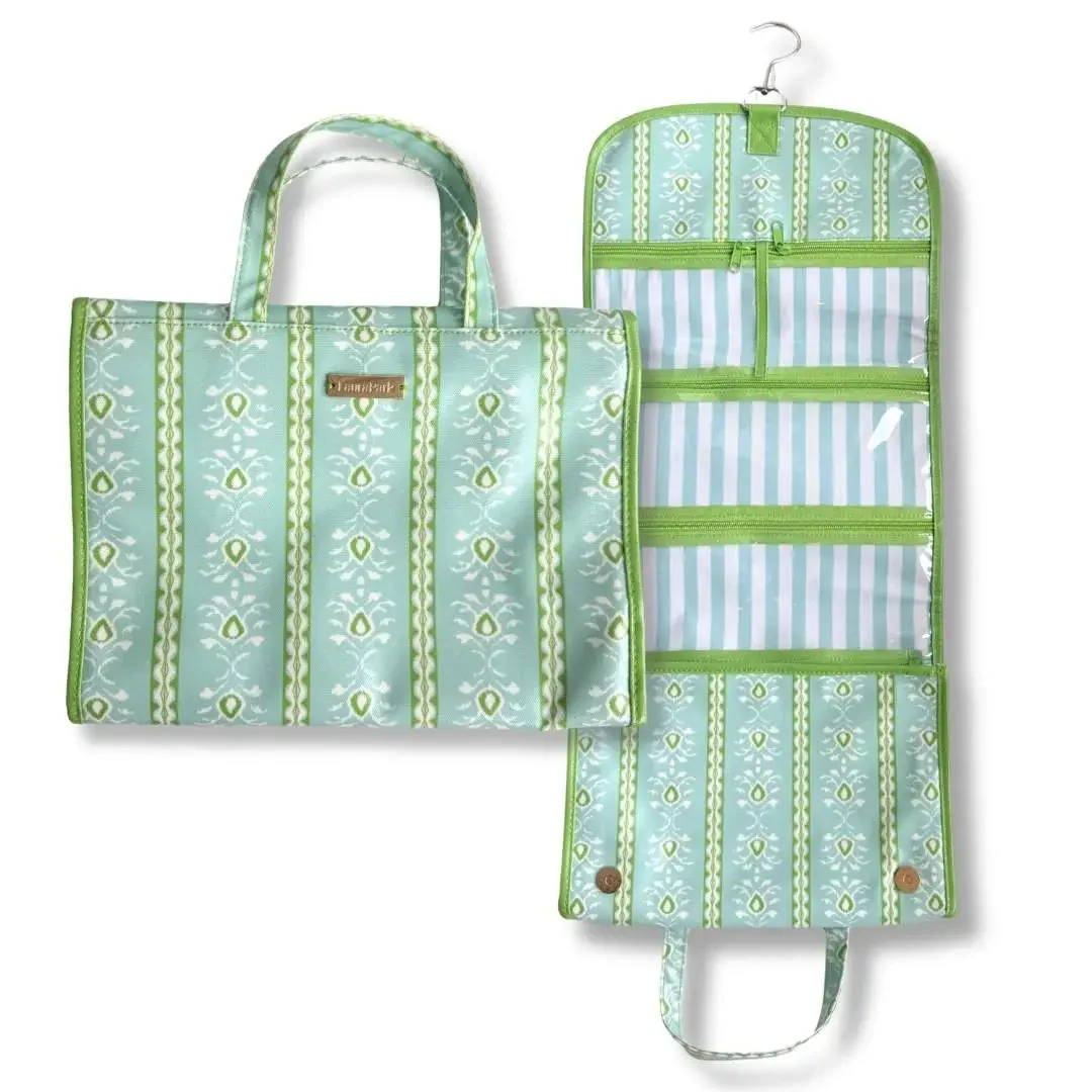 Green and white patterned travel toiletry bag shown closed with handles and open to reveal multiple zippered compartments and a hanging hook.