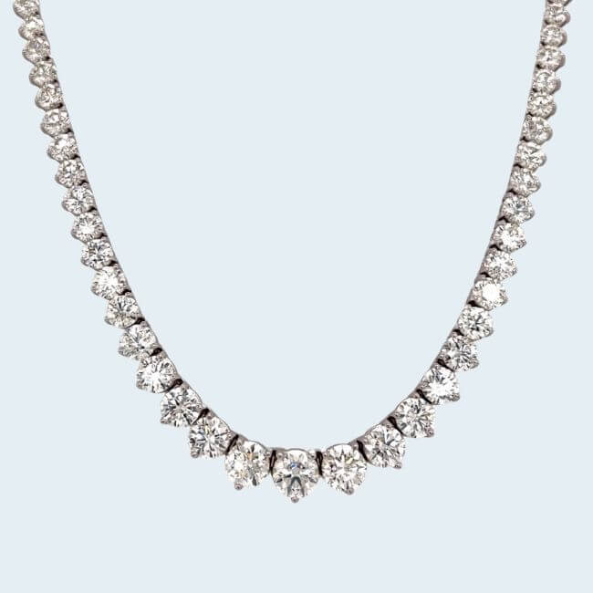 16 Luxe Louisville FINDS for July: Fine Art, Rare Bourbon & Resort-Ready Style - 12 A Louisville Finds July treasure, this diamond necklace features a graduated row of round-cut diamonds set in a symmetrical pattern on a white background.