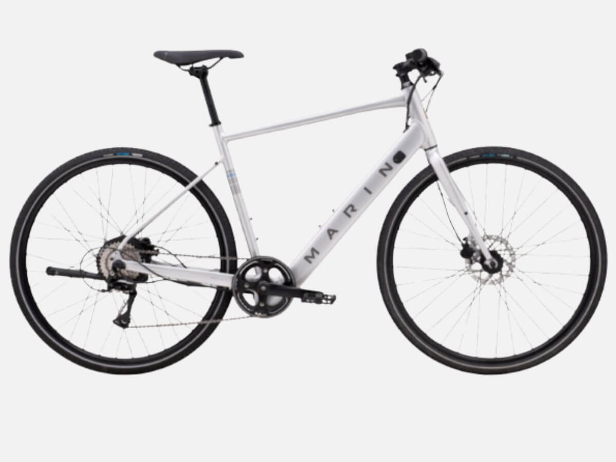 16 Luxe Louisville FINDS for July: Fine Art, Rare Bourbon & Resort-Ready Style - 14 A silver Marin hybrid bicycle with flat handlebars, a black saddle, disc brakes, and thin tires is featured in this Louisville Finds July showcase, displayed on a white background.