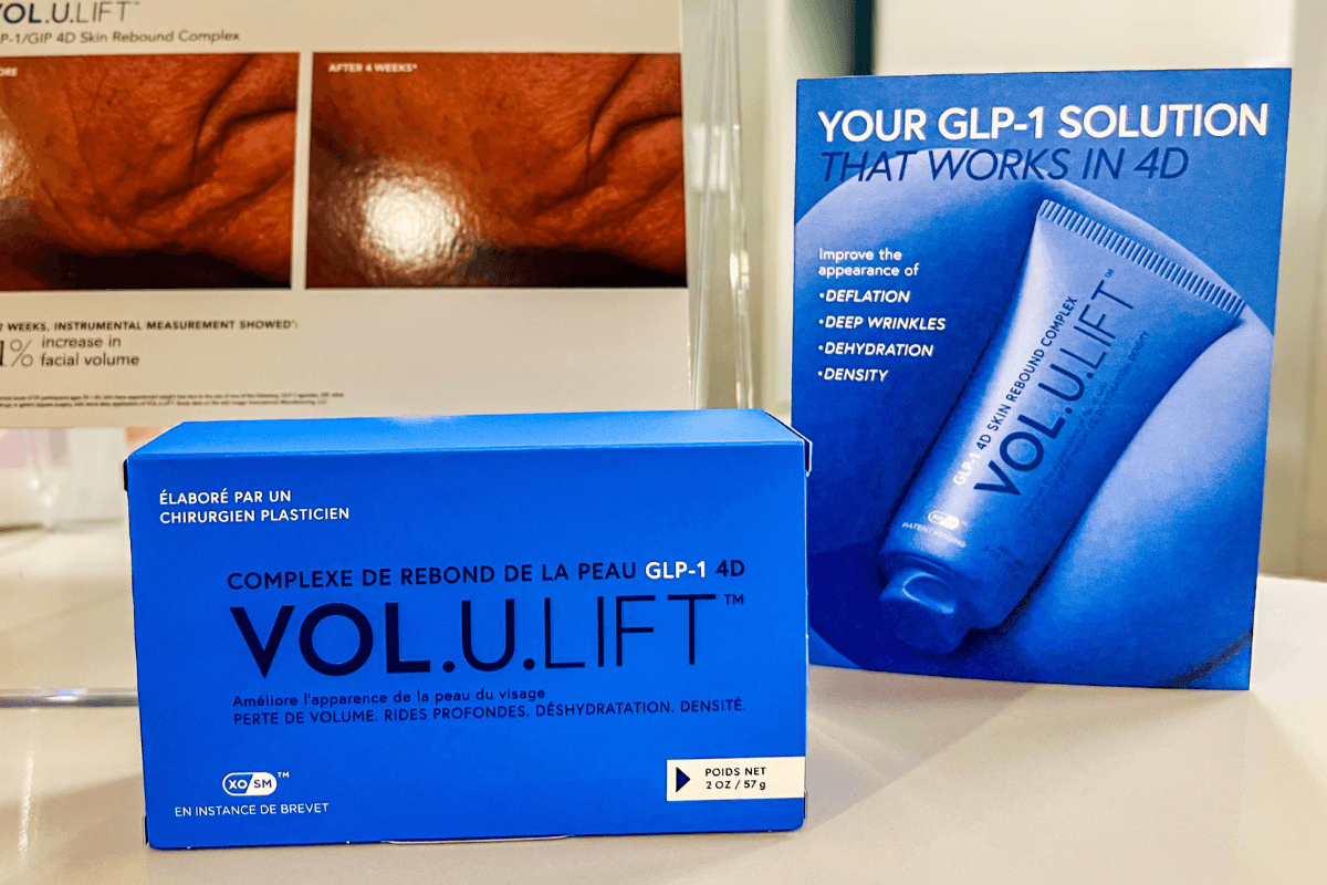 20 Memphis FINDS to See You Through the End of Summer - 20 A blue box labeled "VOL.U.LIFT" sits in front of a display showing a tube of the same product and describing its benefits for skin, such as reducing wrinkles and dehydration.