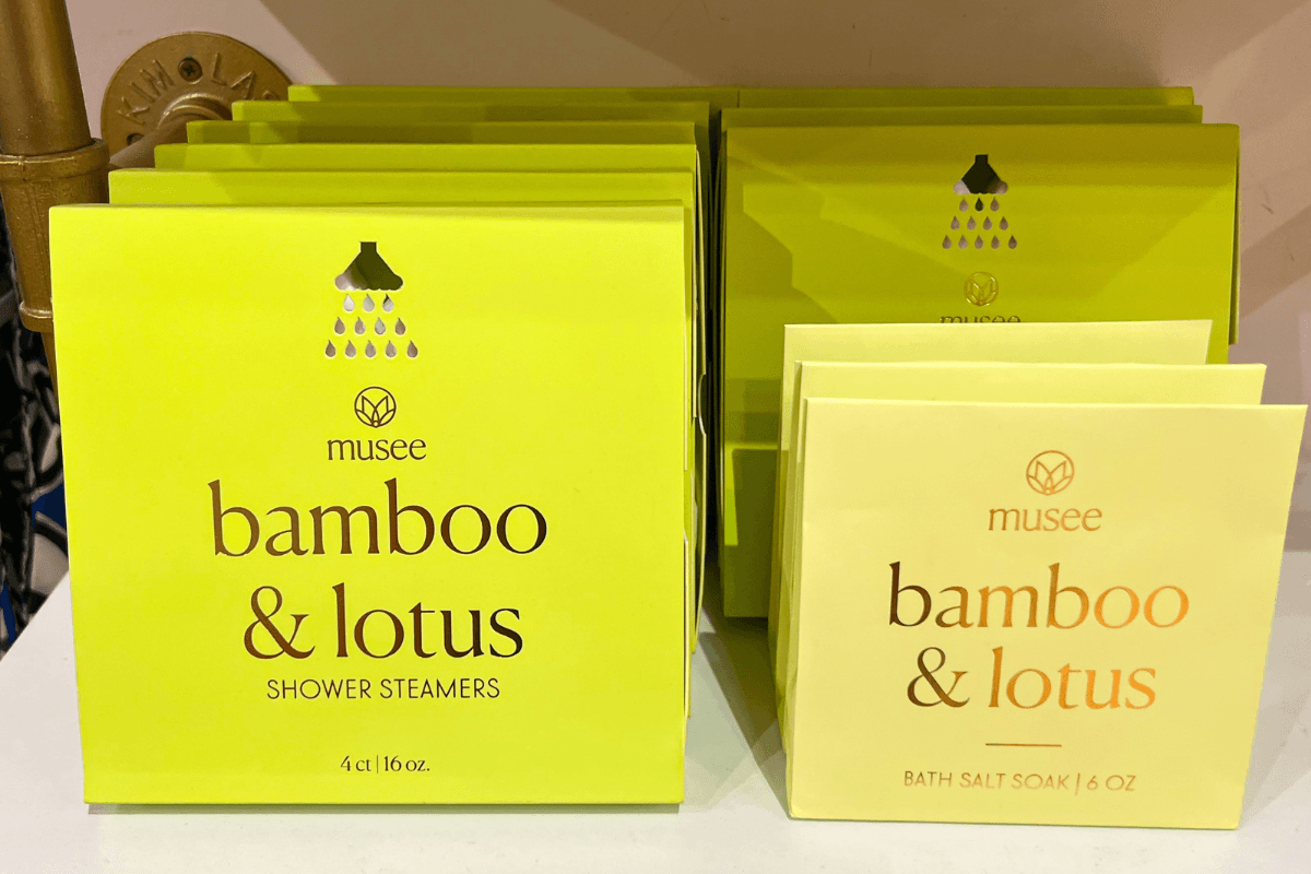 20 Memphis FINDS to See You Through the End of Summer - 16 Packages of Musee brand bamboo & lotus shower steamers and bath salt soak, displayed on a shelf.