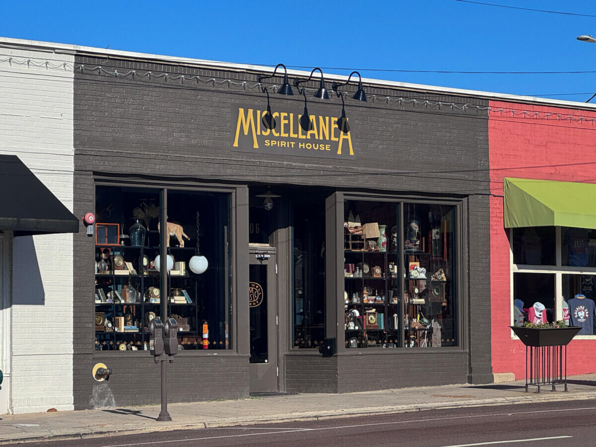 An Ode to Oxford: How to Eat Your Way Through This Delicious Small Town - 11 A storefront with the sign "Miscellanea Spirit House" displays various items in its large windows on a sunny day.