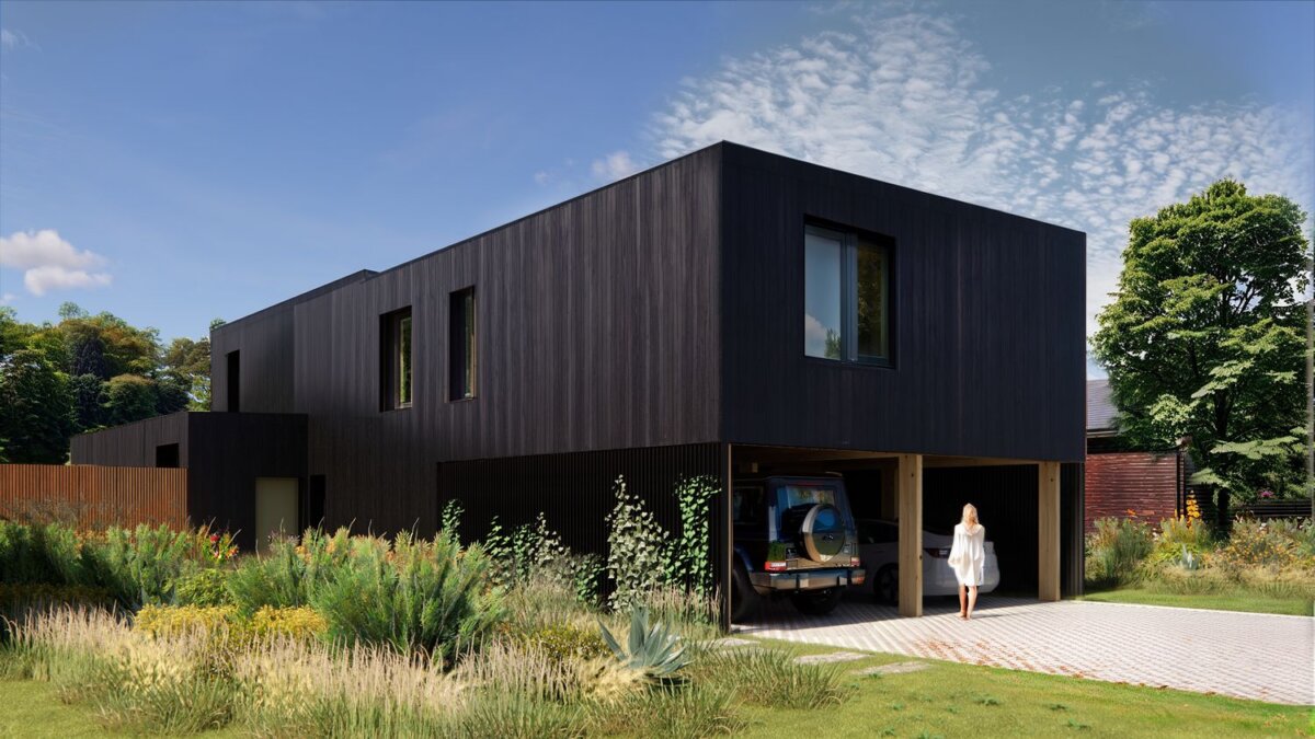 A modern black rectangular house on Lot 28, N Jenna Ct, Nashville, with a garage, parked SUV, and a person in white walking on the driveway, surrounded by greenery.