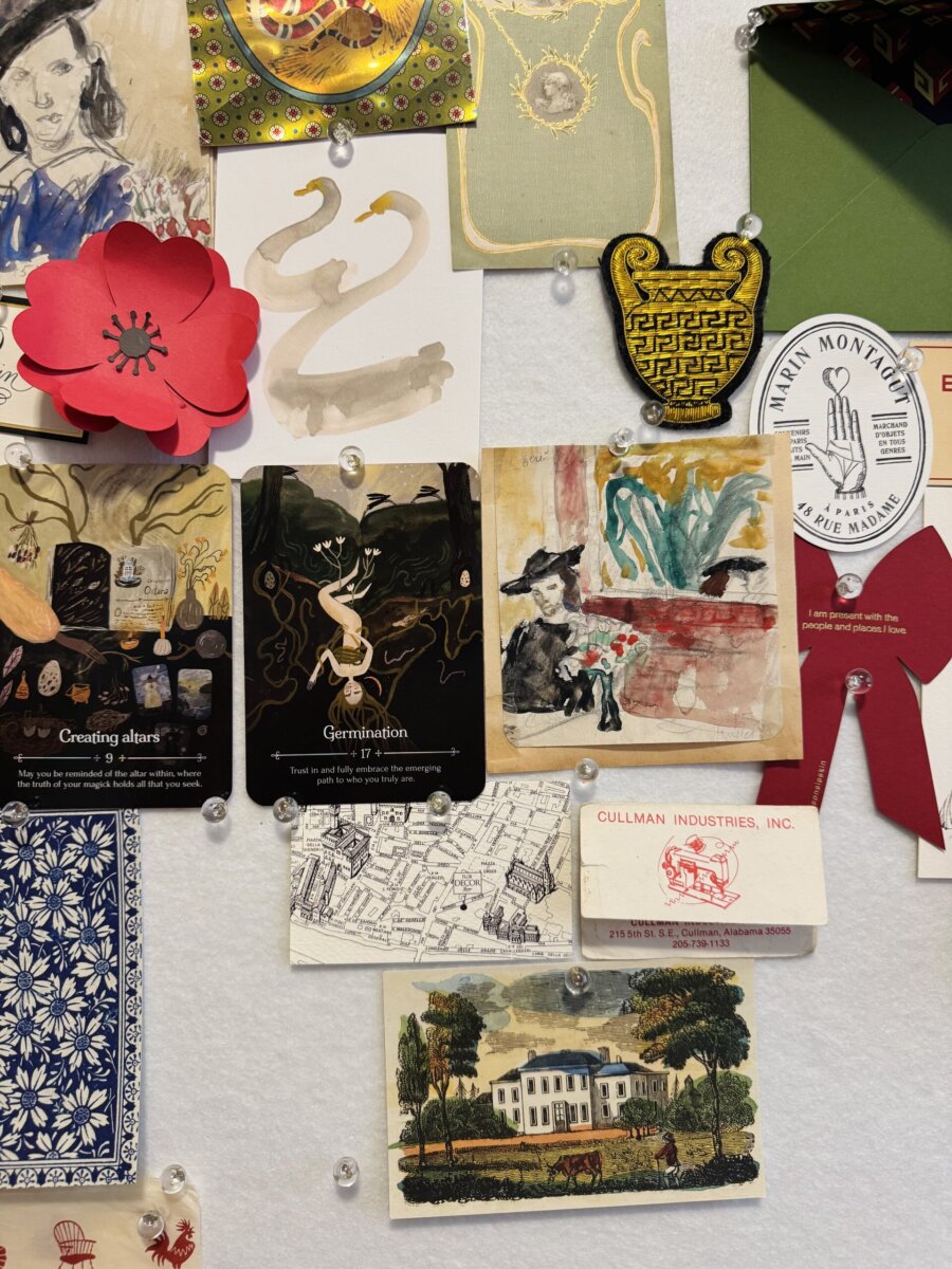 Step into the World of BHAM Artist Morgan Jones Johnston - 3 A bulletin board with various pinned items, including art postcards, a red paper flower, business cards, and a decorative mapβall secured with clear push-pinsβreflects the eclectic style of Morgan Jones Johnston and captures that distinctive Rugged and Fancy aesthetic.