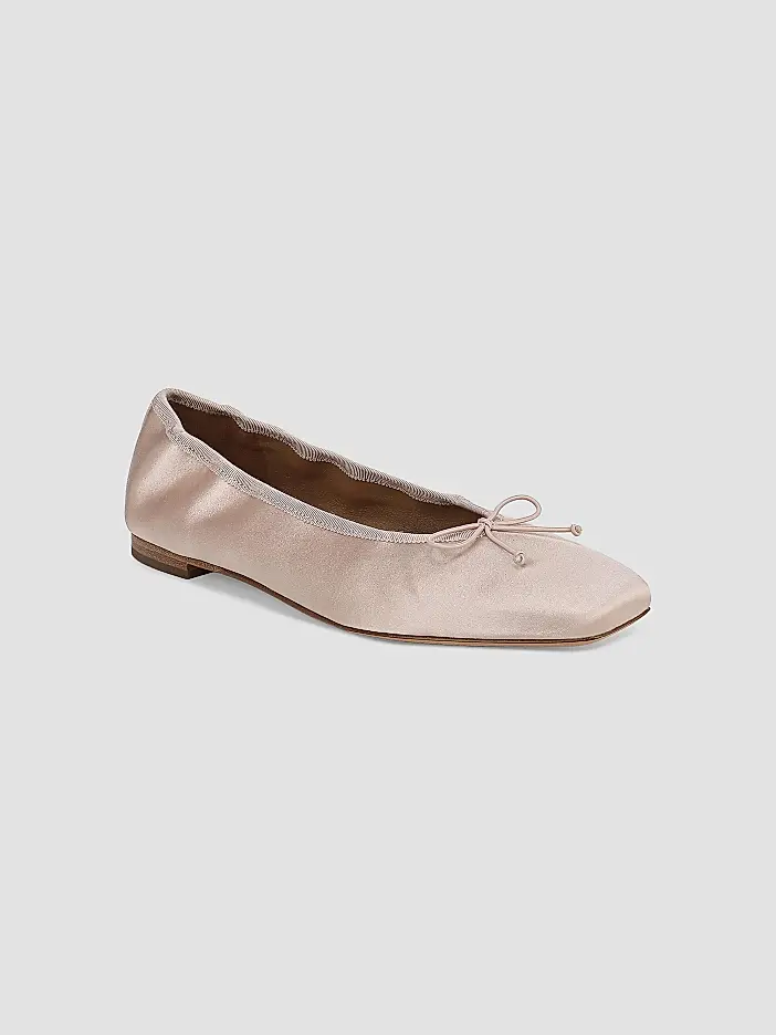Light pink satin ballet flat with a square toe, small bow on top, and flat sole—an elegant addition to your fall fashion lineup—displayed on a plain light gray background.
