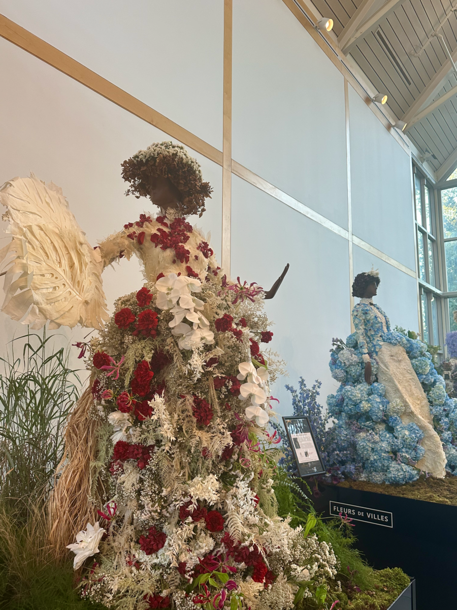 Fleurs de Villes: Cheekwood’s Latest Exhibit is a Must-See - 3 Two mannequins dressed in elaborate gowns made from real flowers and greenery are displayed indoors at a Cheekwood exhibit.