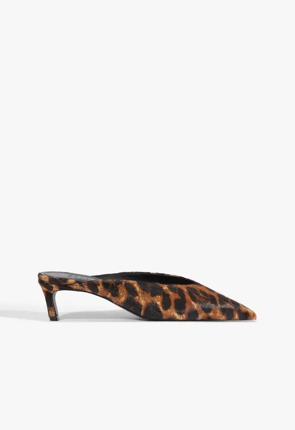 Fall Is Getting Wild: Animal Prints Are Back! - 17 Brown and black leopard print pointed-toe mule with a low kitten heel, viewed from the side against a white background—perfect for embracing Fall Fashion and showcasing this season’s love of Animal Print Trends.