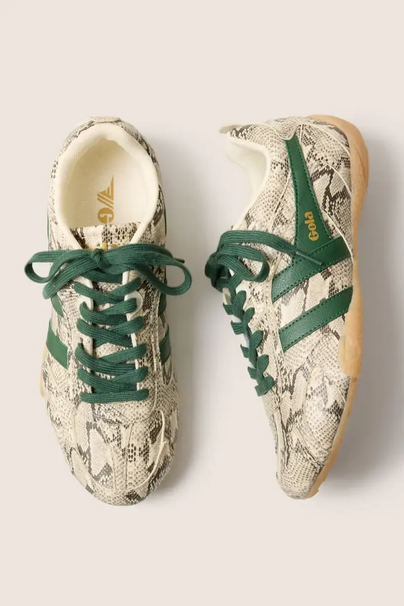 Fall Is Getting Wild: Animal Prints Are Back! - 19 A pair of sneakers with a beige and black snakeskin pattern, green laces and stripes, tan soles, and gold “Gola” branding on the side—perfect for embracing Animal Print Trends in your fall fashion wardrobe.