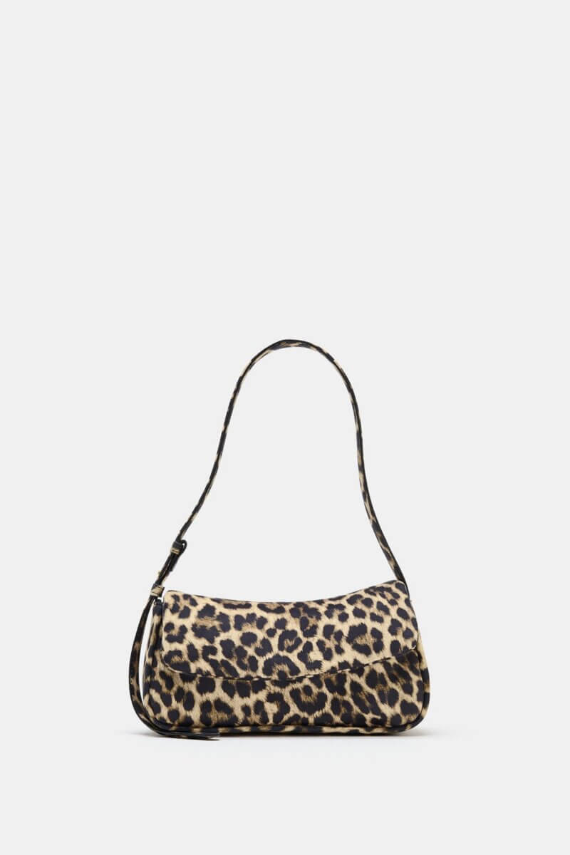 Fall Is Getting Wild: Animal Prints Are Back! - 22 Small handbag with a chic leopard print pattern—perfect for elevating your fall fashion—features a short strap and rounded rectangular shape, set against a plain white background.