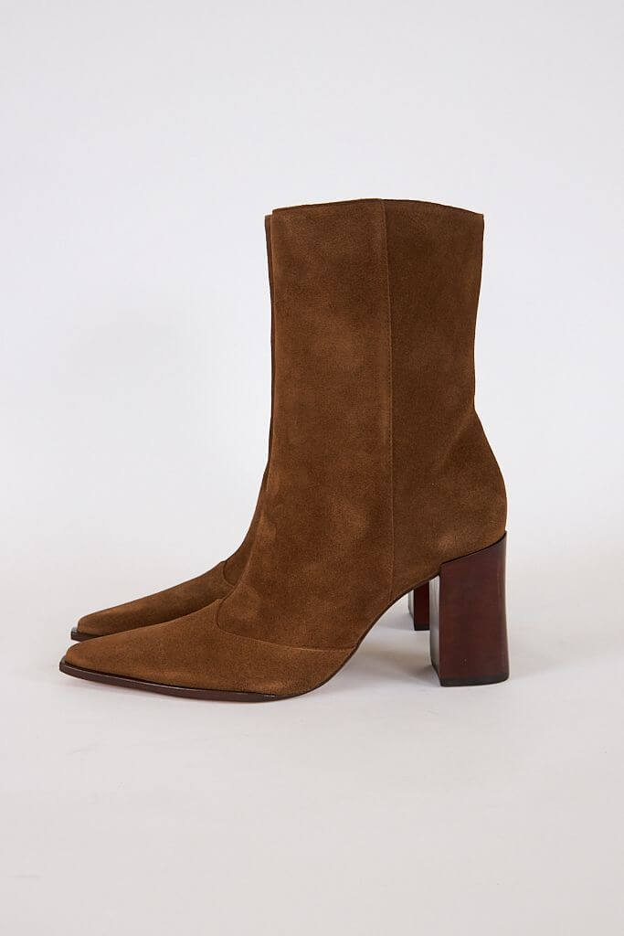 17 Fall-Ready Nashville FINDS: Cozy Layers, Beauty & Spooky Season Style - 5 Brown suede ankle boots with pointed toes and chunky wooden heels—perfect for Nashville finds this October, shown on a plain white background.