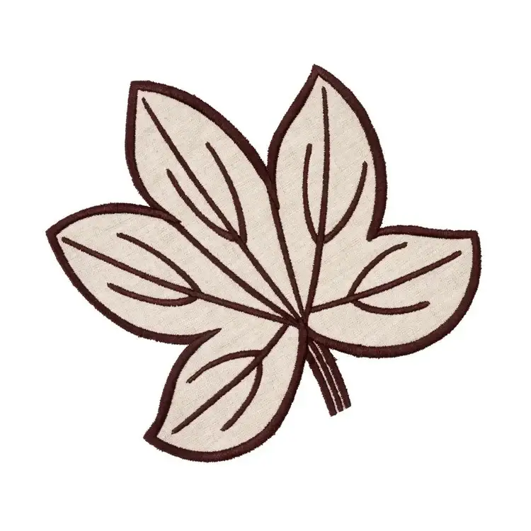 17 Fall-Ready Nashville FINDS: Cozy Layers, Beauty & Spooky Season Style - 13 A beige fabric leaf patch with five lobes and brown stitched outlines, perfect for Nashville finds this October, shown on a white background.