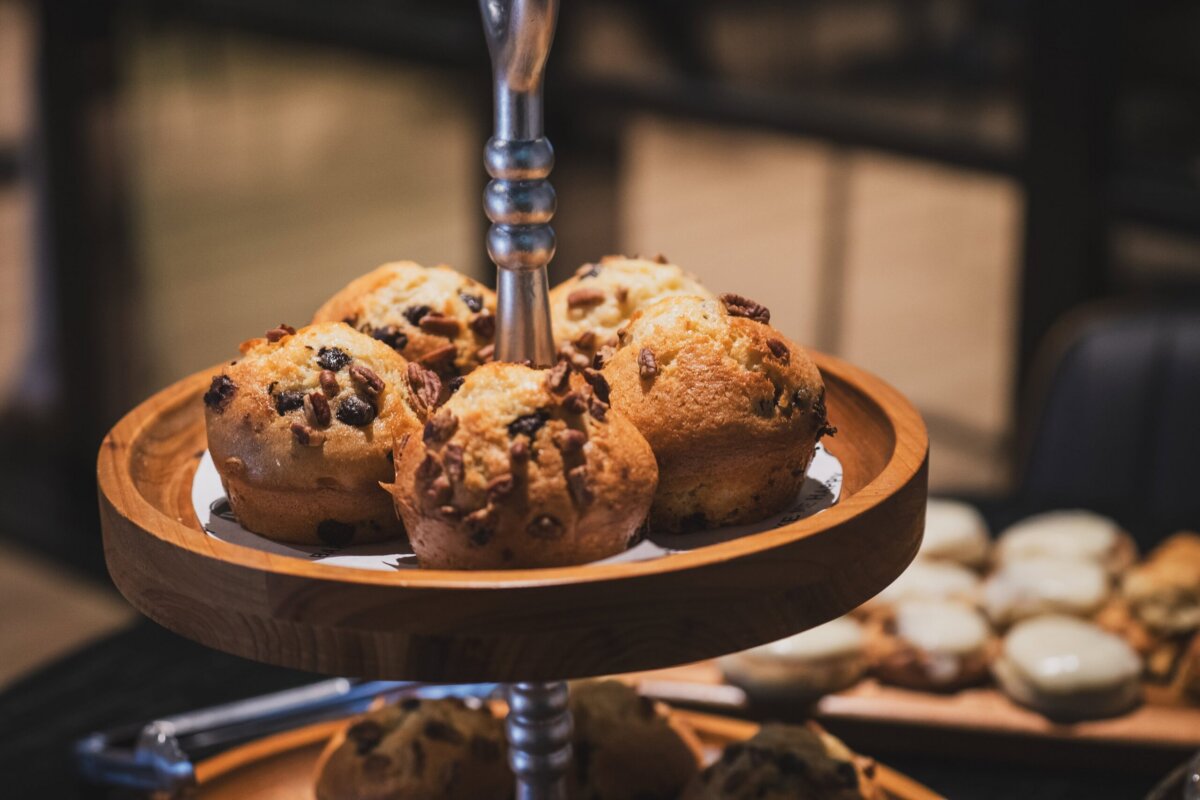 A tiered wooden serving tray holding nut-topped muffins at one of the new Memphis restaurants.