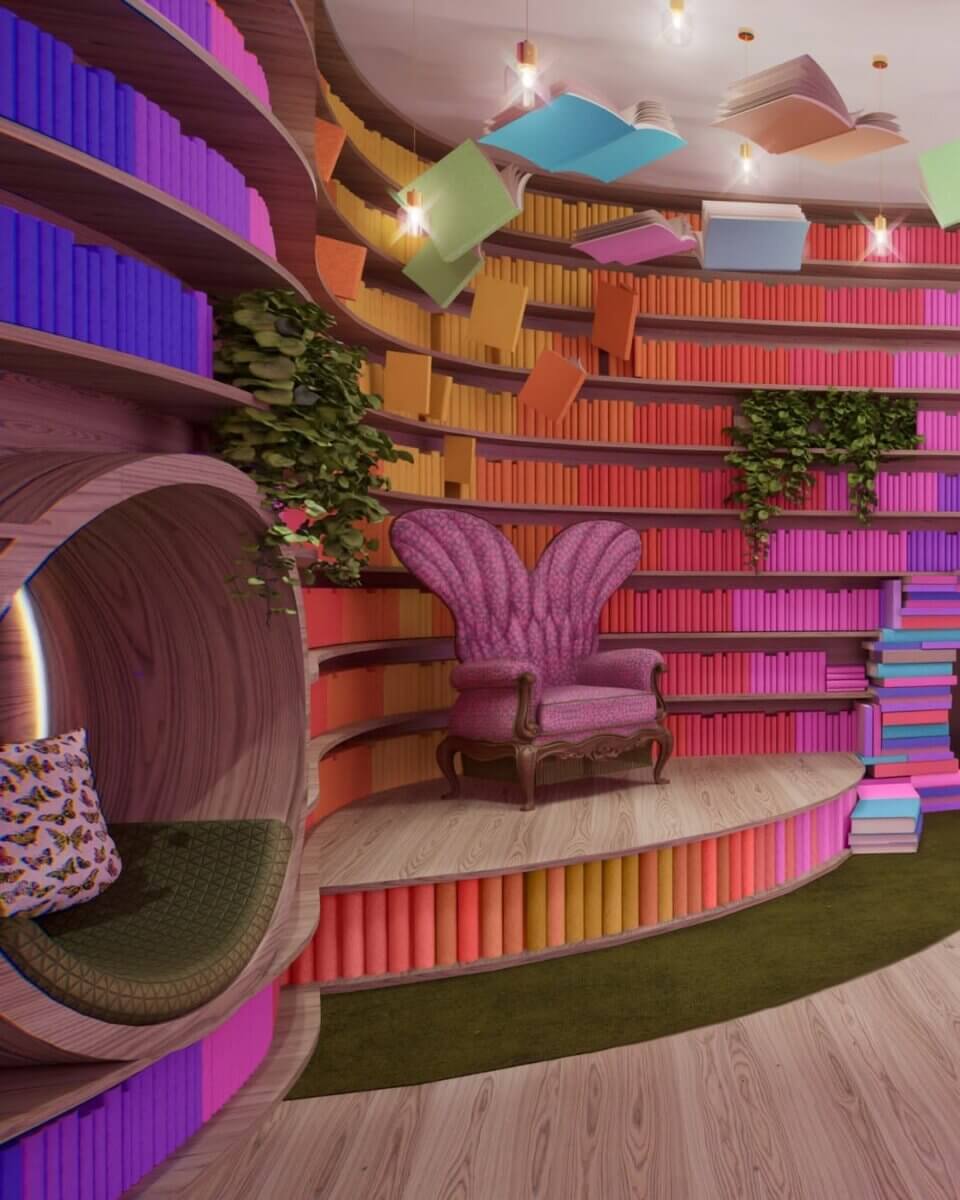 For the Love of Dolly: 7 Ways to Celebrate Her Legacy - 3 Colorful library with curved bookshelves, a pink armchair, circular reading nook, green plants, and books hanging from the ceiling celebrating the Imagination Library in the Life of Many Colors Museum