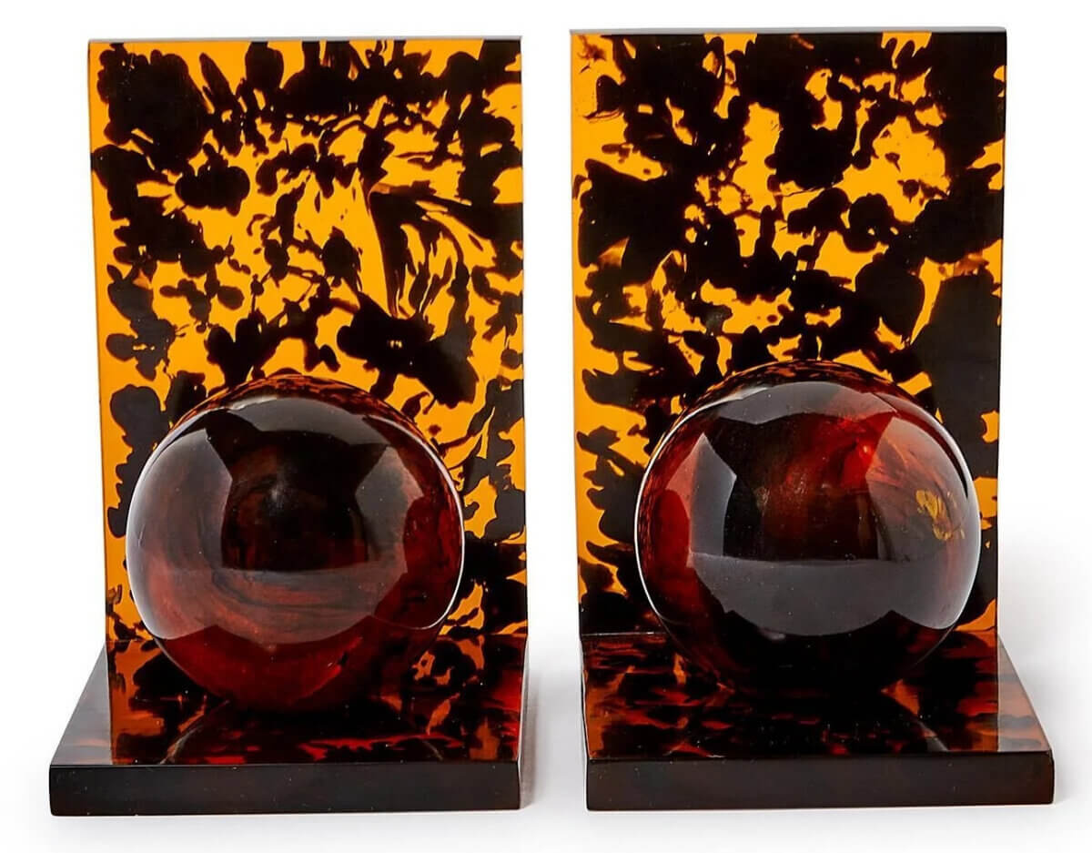 17 Fall-Ready Nashville FINDS: Cozy Layers, Beauty & Spooky Season Style - 16 Pair of rectangular tortoiseshell-patterned bookends with glossy dark brown spheres, a stylish addition to Nashville home decor, shown against a white background.