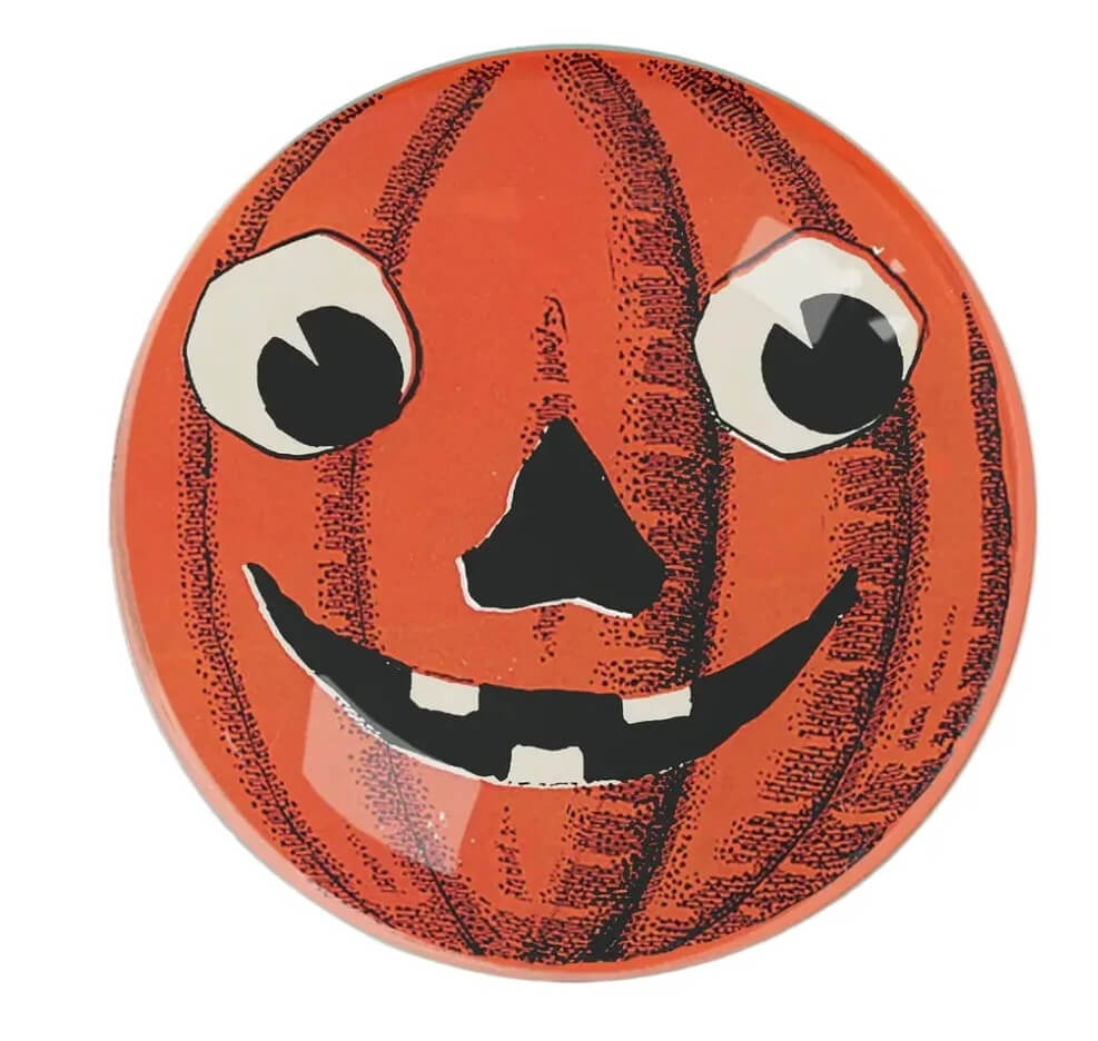 17 Fall-Ready Nashville FINDS: Cozy Layers, Beauty & Spooky Season Style - 17 An orange plate with a jack-o’-lantern face and googly eyes adds playful charm—perfect for Nashville home decor during Halloween festivities.