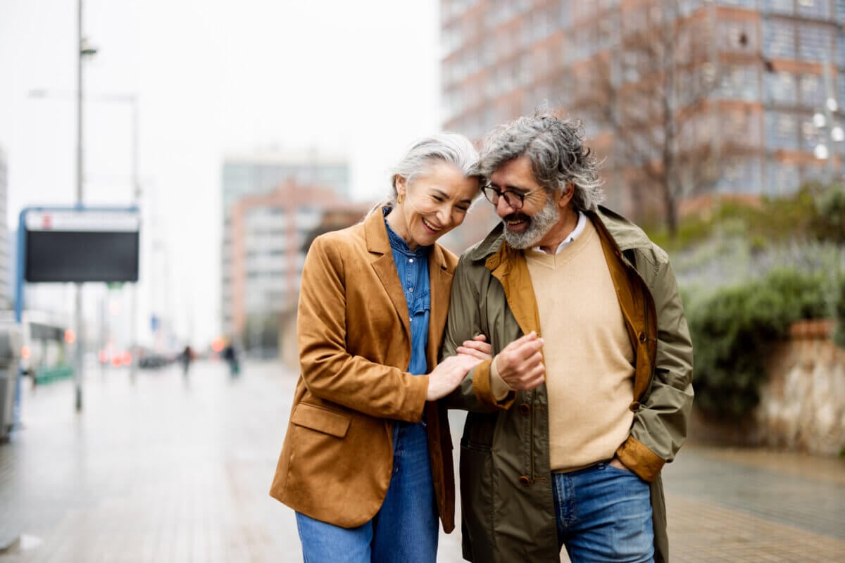How Not to Date a Loser: Therapists Share the Red Flags You Shouldn't Ignore - 4 An older couple walking arm in arm on a city sidewalk, representing the long-term relationship advice that keeps love alive.